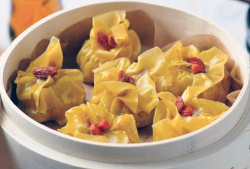 pork and prawn dumplings in a bamboo steamer