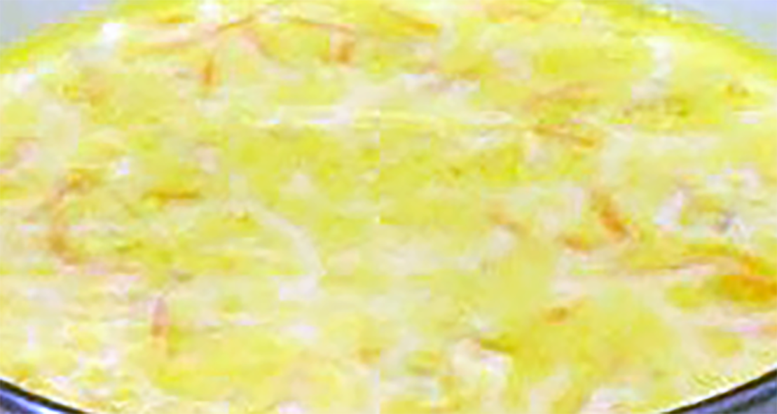 Congolese banana soup simmering in a pan
