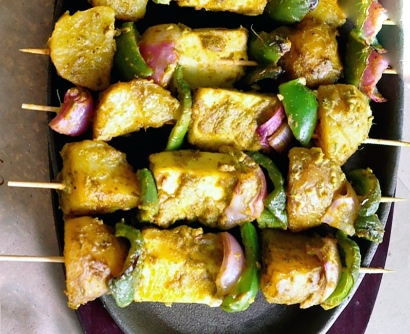 Potato and Cheese Tikka Skewers on a plate