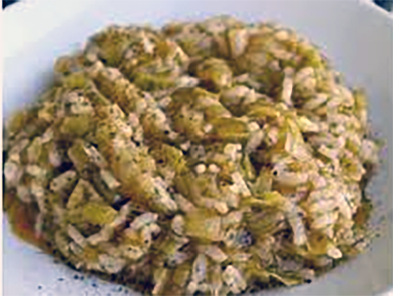 Prassa, Armenian leek and rice stew served in a white bowl