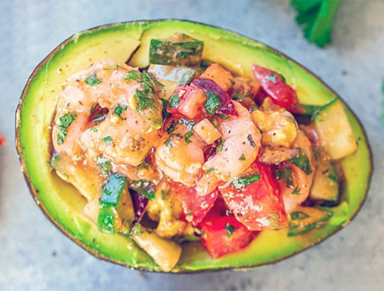 avocado stuffed with prawns, onion, radish and bell pepper in an aioli base
