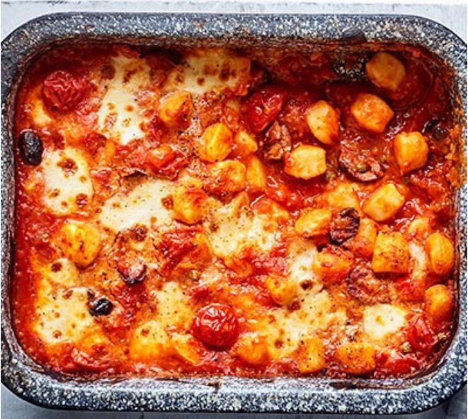gnocchi baked in a puttanesca sauce in a roasting tin