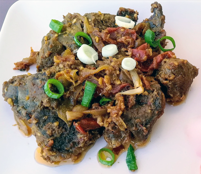 ritra of goose shown on a white chopping board