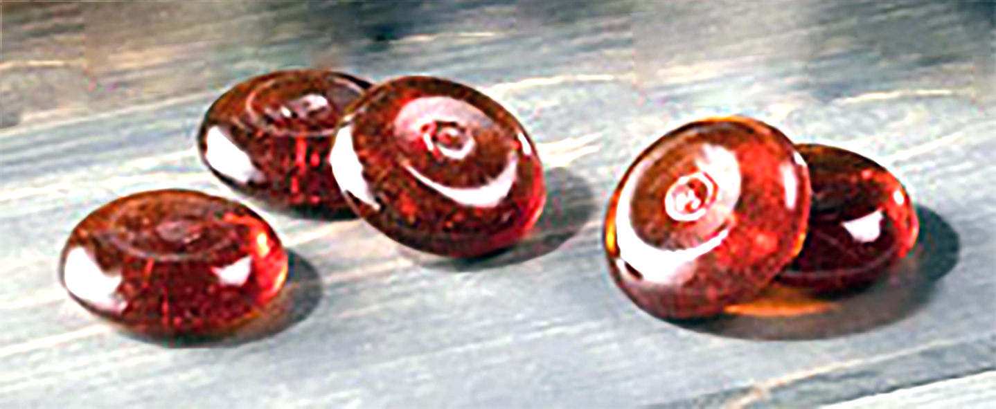 red rooibos candies on a wooden board