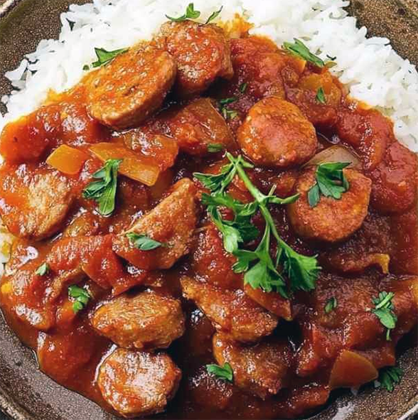 Sausage rougail served on a bed of rice