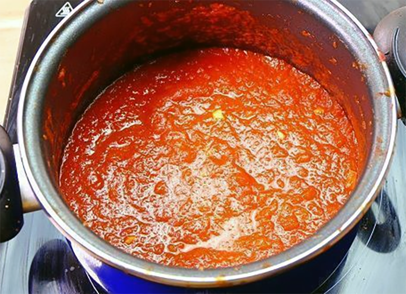 home-style tomato sauce in a stock pot