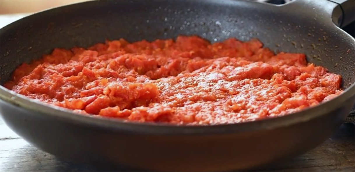 fried tomato sauce in a frying pan