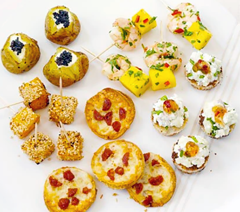 six different party bites arranged on a table cloth