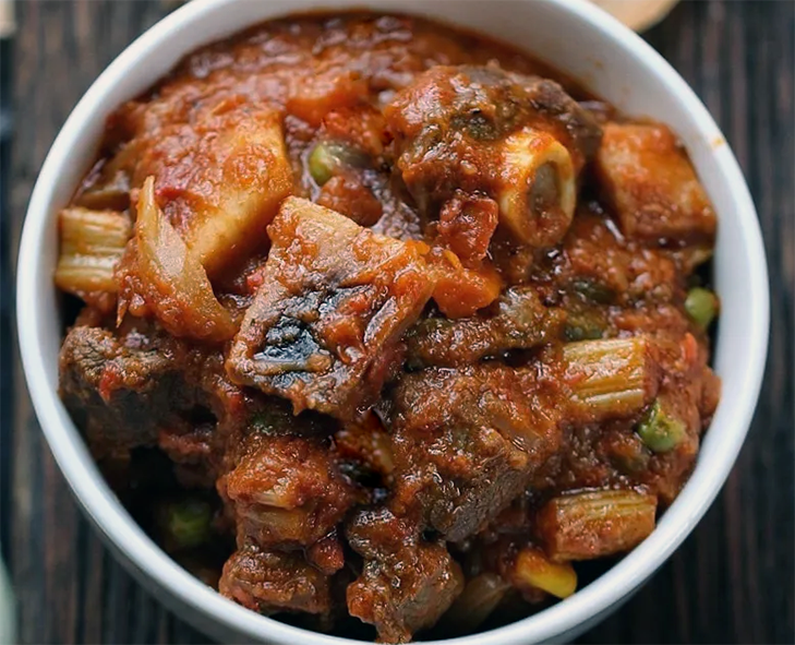 stewed goat meat presented in a bowl