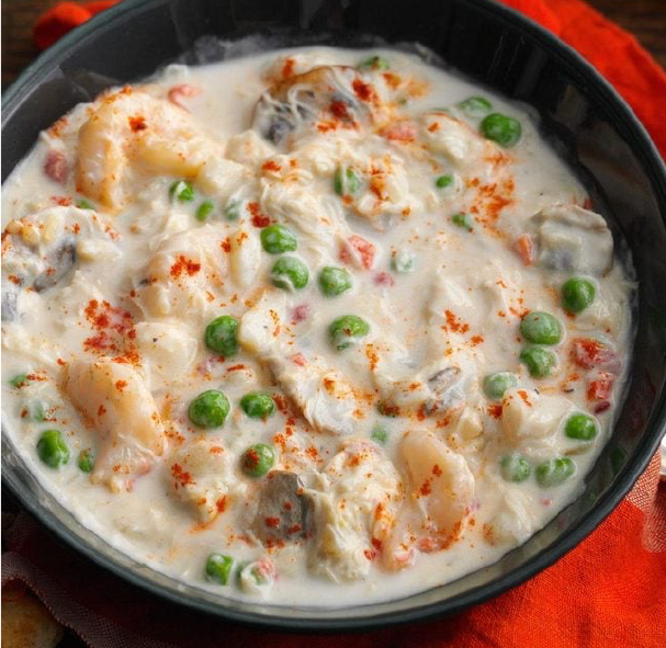 Irish seafood chowder with peas served in a bowl
