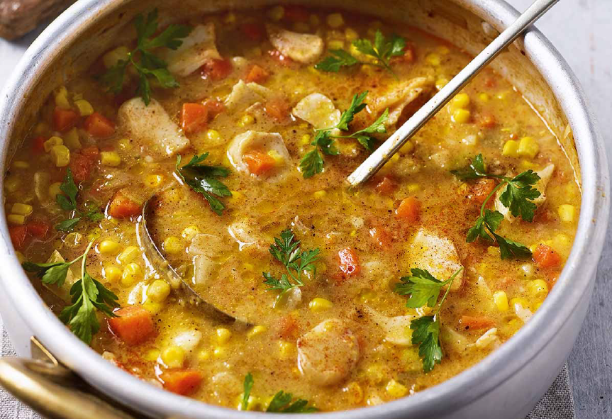 smoked haddock chowder with sweetcorn and cottage cheese in a steel cooking pot