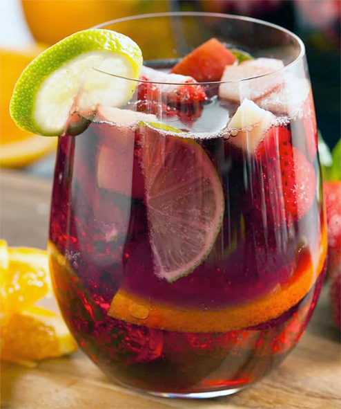 Virgin sangria in a stemless wine glass filled with fruit