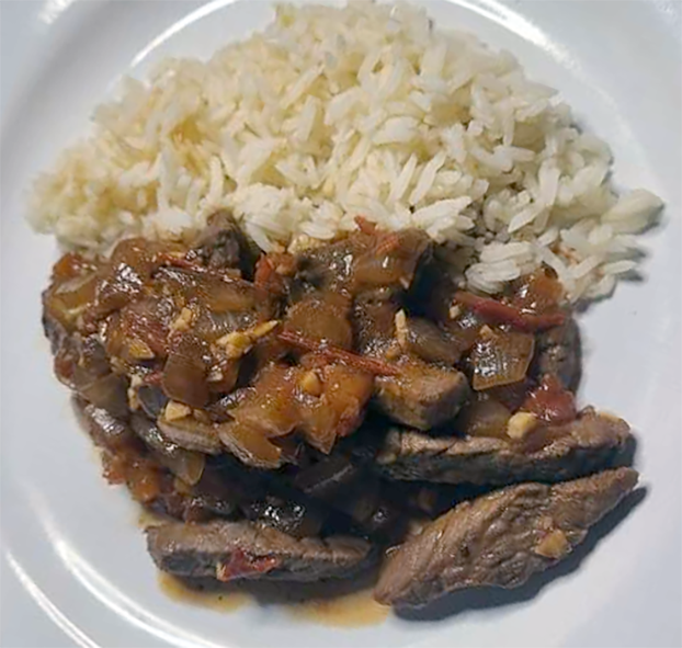 beef and tomato sokosoko served on a plate with rice