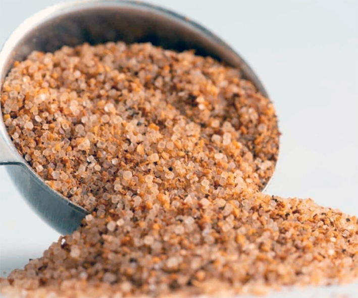 creole seasoning shown spilling out of a jar