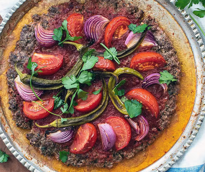 Turkish tray kebab served on a metal tray