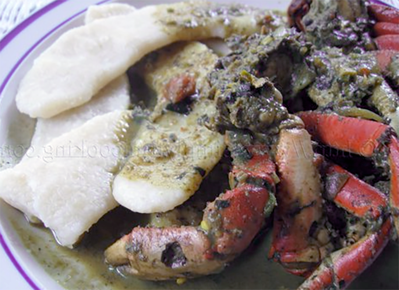 Tobagan curry crab served on a plate with cassava dumplings