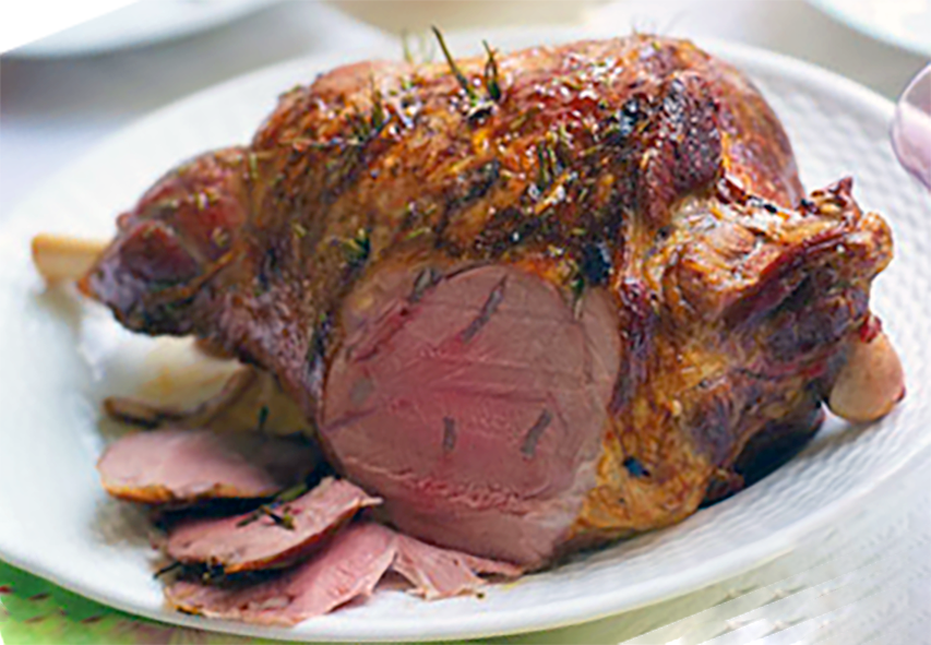 redcurrant glazed roast leg of lamb with a few slices removed