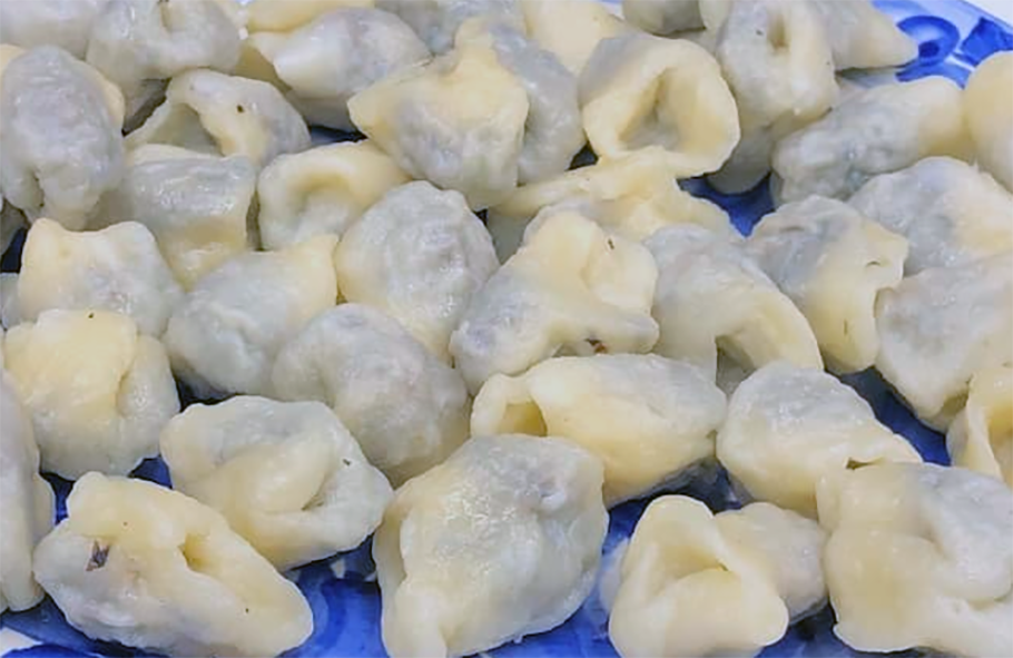 uszka dumplings arranged on a plate