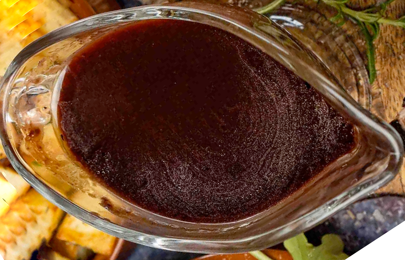 Viennese game sauce presented in a glass gravy boat and viewed from above