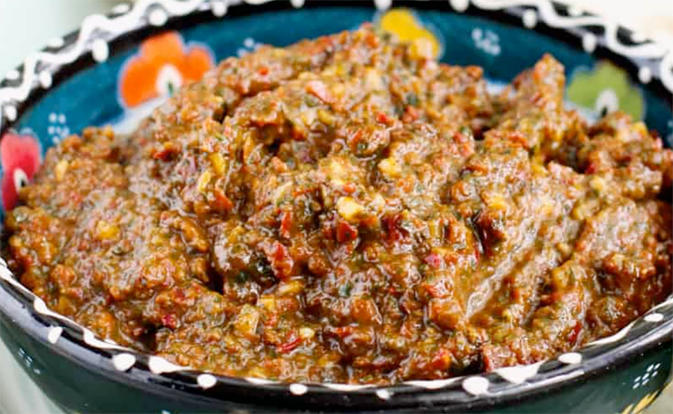 red zhoug paste presented in a bowl