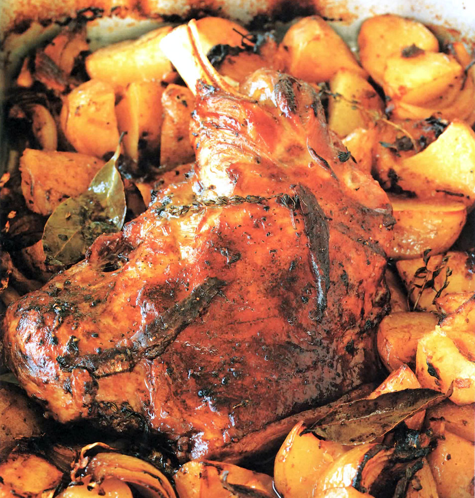 Rustic Lamb Shoulder Roast: classic Welsh dish of lamb braised in white wine on potatoes and onions for Easter